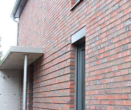 Neubau eines Einfamilienhauses in Ahrensburg mit Stahlbetonüberdachung Neubau eines Einfamilienhauses in Ahrensburg mit Stahlbetonüberdachung